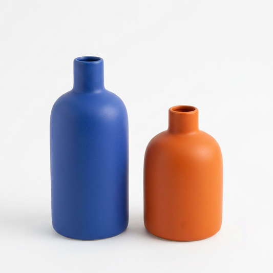 Blue and orange decorative vase pair on white